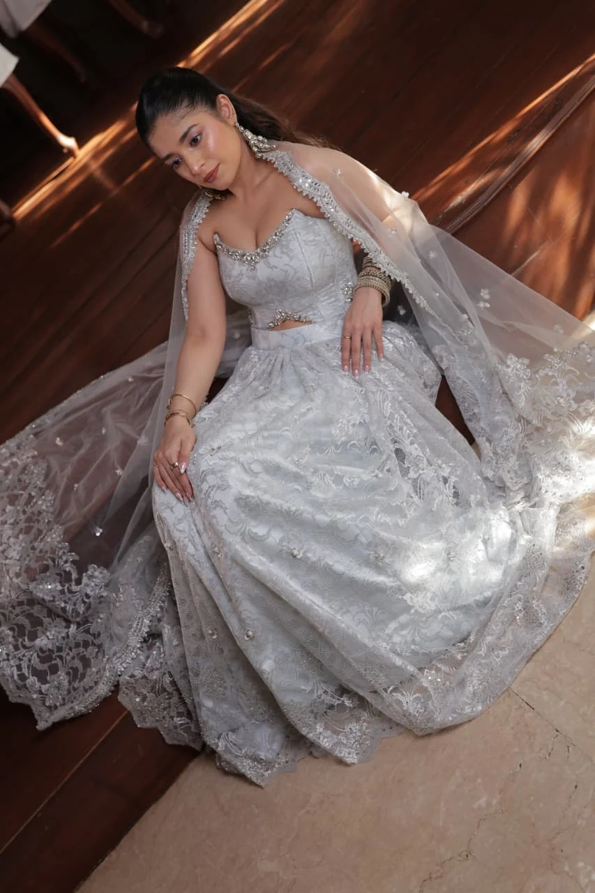 Silver bridal couture gown with veil and dramatic train